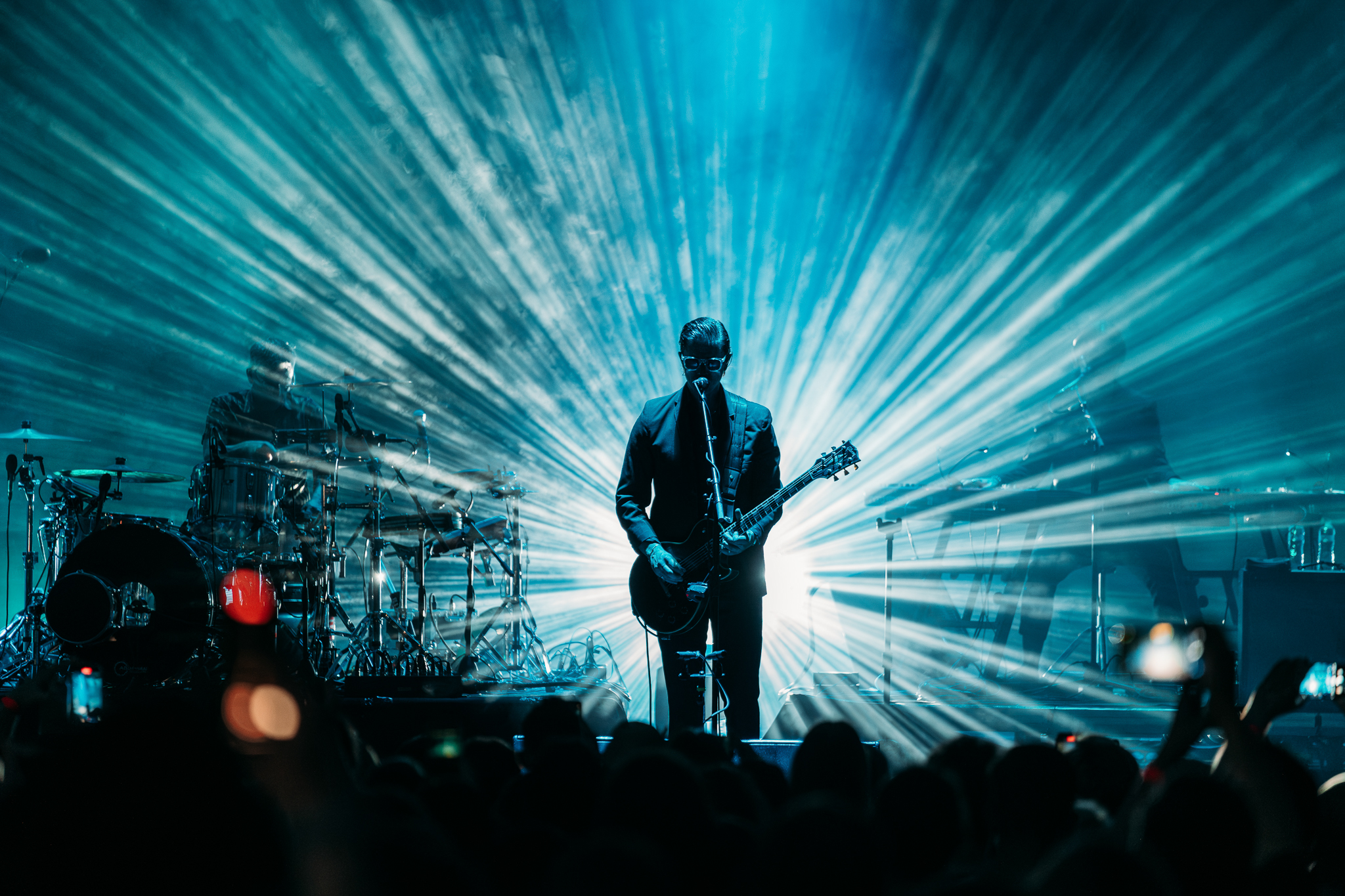Concert photography - silhouette against blue stage lights
